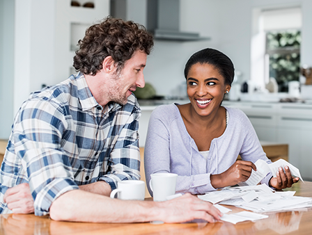 Couple sitting at kitchen table