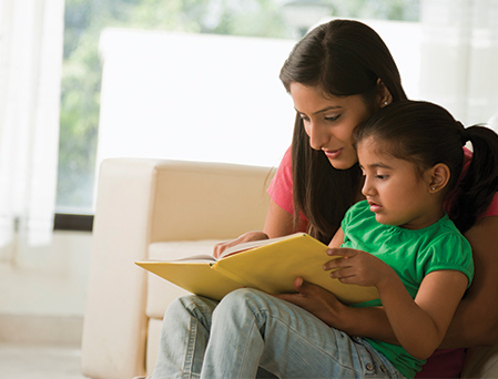 Mother and daughter reading together