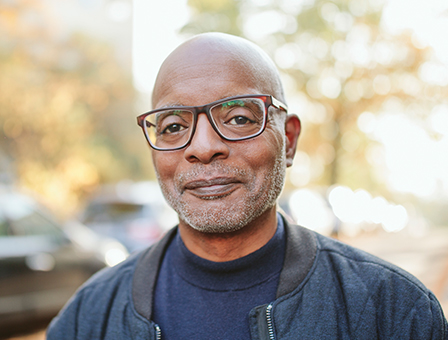 African American man in his 50's in a park setting