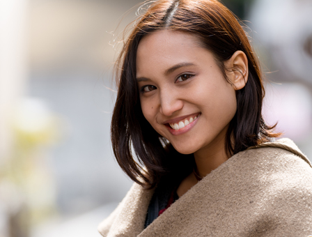 30's caucasian woman with dark hair smiling