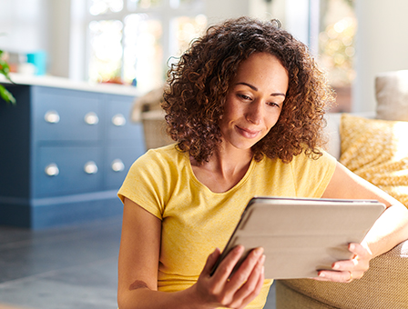 woman looking at tablet